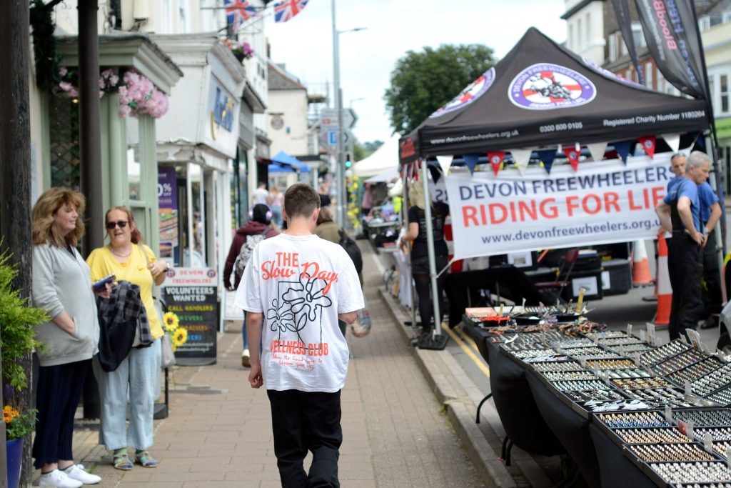 Honiton street market with various market stalls including Devon Freewheelers.